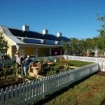 Residential solar panels on homeowners sloped roof gardening