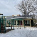 Residential multi-family dwelling solar energy panels playground